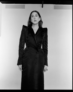 RVDK Ronald van der Kemp couture’s sculptural techno duchesse satin tailored tuxedo gown. Yun Yun Sun earrings and ring.