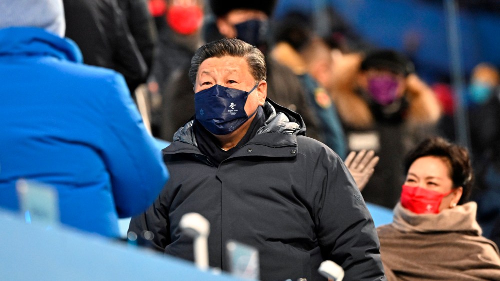 China's President Xi Jinping (C) looks on during the opening ceremony of the Beijing 2022 Winter Olympic Games, at the National Stadium, known as the Bird's Nest, in Beijing, on February 4, 2022. (Photo by Anthony WALLACE / various sources / AFP)