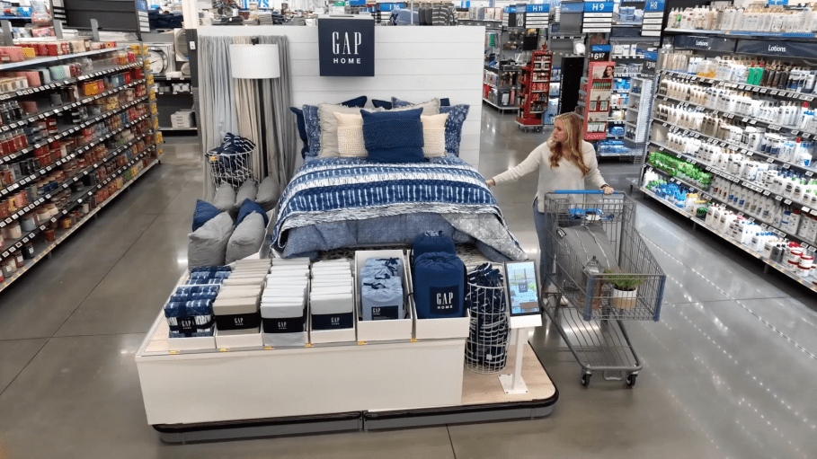 The Gap Home at Walmart activation within Store 4108 includes a full bedding display with all related products in clear view up front, and a digital screen to aid the consumer.