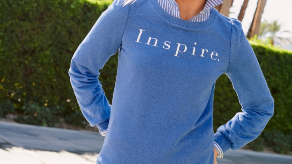 Niki Taylor wearing one of the Talbots sweatshirts that will benefit Dress for Success.