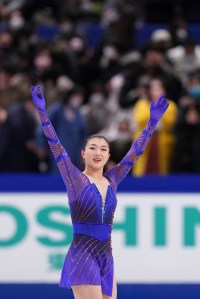 Japanese figure skater Kaori Sakamoto reacts after winnin the women's free program of the All Japan Figure Skating Championships at Saitama Super Arena on Dec.25, 2021. 21-year-old Sakamoto topped the event to earn the spot for the Beijing Olympics. ( The Yomiuri Shimbun via AP Images )
