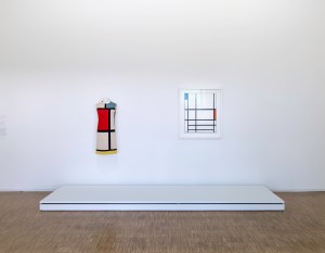 An Yves Saint Laurent Hommage à Piet Mondrian dress from 1965 next to a 1937 Mondrian painting at the Pompidou Center in Paris.
