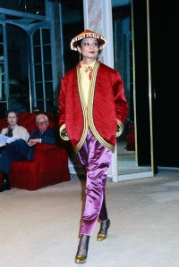 A model poses in an ensemble from Yves Saint Laurent's Couture Fall 1977 "Les Chinoises" collection presentation at the designers Paris atelier.