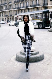 Mounia Orsemane in an ensemble from the Yves Saint Laurent RTW Fall 1978 collection shot on the streets of Paris on March 15, 1978.