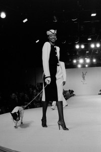 Mounia poses with Moujik the bulldog in Yves Saint Laurents RTW Spring 1980 collection inspired by artist Pablo Picasso.