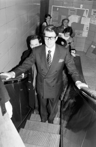 Yves Saint Laurent rides an escalator at the Fashion Institute of Technology during a visit to New York on December 7, 1983.