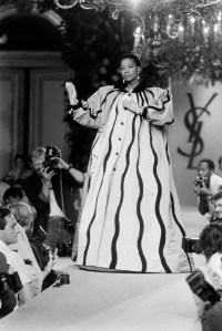 Model Mounia Orosemane on the runway at Yves Saint Laurent Couture Fall 1984.