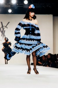 Sayoko Yamaguchi poses on the runway in a graphic print dress from the YSL Spring RTW 1980 collection.
