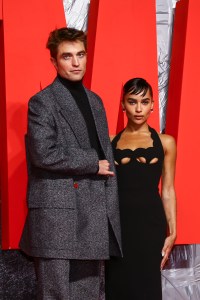 Robert Pattinson, left, and Zoe Kravitz pose for photographers upon arrival for the screening of the film 'The Batman' in London Wednesday, Feb. 23, 2022. (Photo by Joel C Ryan/Invision/AP)