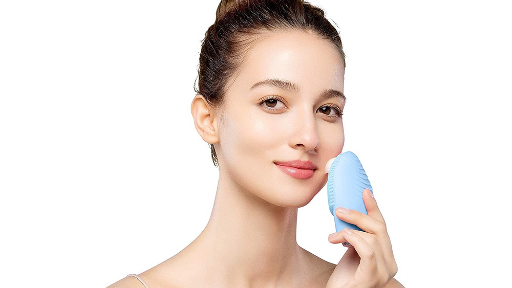 Woman holding foreo brush