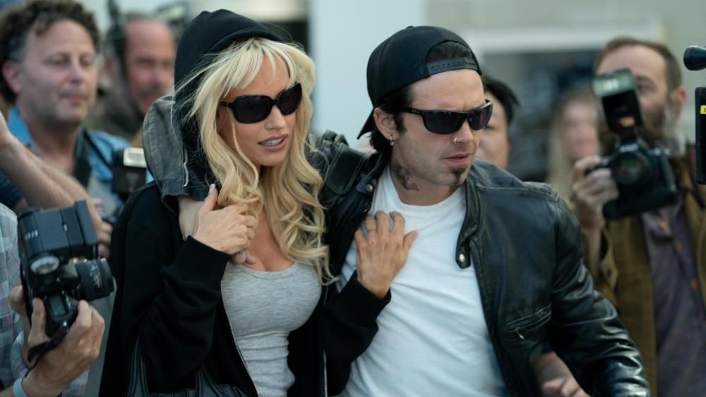 Pam & Tommy -- “I Love You, Tommy" - Episode 102 -- Pamela Anderson and Tommy Lee meet, get high and get married… all in four days. Pam (Lily James) and Tommy (Sebastian Stan), shown. (Photo by: Erin Simkin/Hulu)