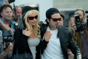 Pam & Tommy -- “I Love You, Tommy" - Episode 102 -- Pamela Anderson and Tommy Lee meet, get high and get married… all in four days. Pam (Lily James) and Tommy (Sebastian Stan), shown. (Photo by: Erin Simkin/Hulu)