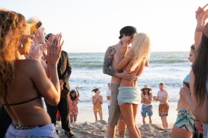 Pam & Tommy -- “I Love You, Tommy" - Episode 102 -- Pamela Anderson and Tommy Lee meet, get high and get married… all in four days. Melanie (Pepi Sonuga), Ace (Zack Gold), Priest (Alberto Manquero), Tommy (Sebastian Stan), and Pam (Lily James), shown. (Photo by: Erin Simkin/Hulu)