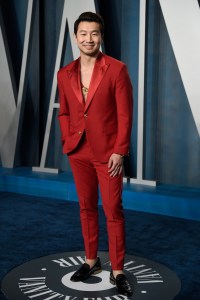 Simu Liu arrives at the Vanity Fair Oscar Party on Sunday, March 27, 2022, at the Wallis Annenberg Center for the Performing Arts in Beverly Hills, Calif. (Photo by Evan Agostini/Invision/AP)