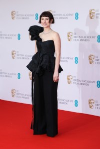 Jessie Buckley poses for photographers upon arrival at the 75th British Academy Film Awards, BAFTA's, in London Sunday, March 13, 2022. (Photo by Vianney Le Caer/Invision/AP)