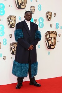 Daniel Kaluuya poses for photographers upon arrival at the 75th British Academy Film Awards, BAFTA's, in London Sunday, March 13, 2022. (Photo by Joel C Ryan/Invision/AP)