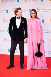 Tom Hiddleston and Zawe Ashton pose for photographers upon arrival at the 75th British Academy Film Awards, BAFTA's, in London Sunday, March 13, 2022. (Photo by Vianney Le Caer/Invision/AP)