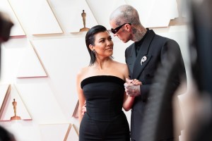 Kourtney Kardashian and Travis Barker at the 2022 Oscars.
