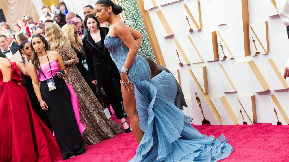 Megan Thee Stallion walks the red carpet at the 94th Academy Awards held at the Dolby Theatre in Hollywood, CA on March 27, 2022 wearing a crystal-encrusted blue Gaurav Gupta gown.