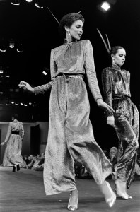 Alva Chinn the runway in iridescent evening wear and slingback pumps from Chanel's RTW Fall 1979 collection designed by artistic director Philippe Guibourge.