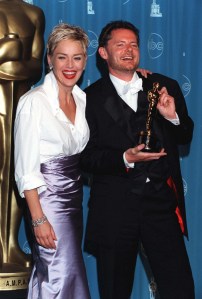 Sharon Stone in Gap and Vera Wang and director Mike van Diem at the 1998 Oscars 
