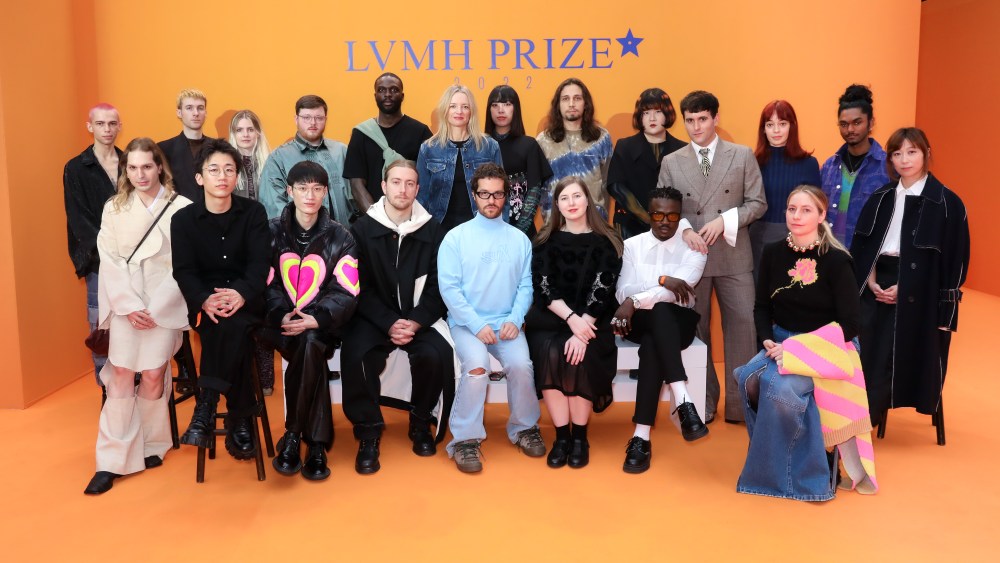 The 19 semifinalists of the LVMH Prize for Young Designers pose with Delphine Arnault.