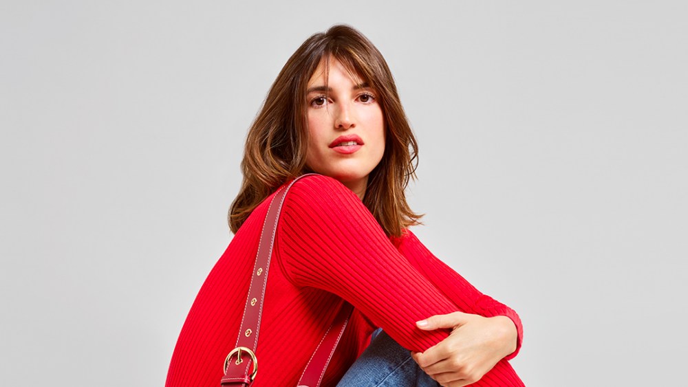Jeanne Damas with her bag design for Lancel.