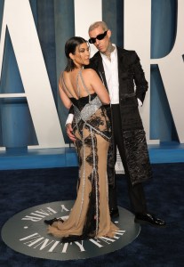 Kourtney Kardashian and Travis Barker at the Vanity Fair Oscar Party held at the Wallis Annenberg Center for the Performing Arts on March 27th, 2022 in Beverly Hills, California.