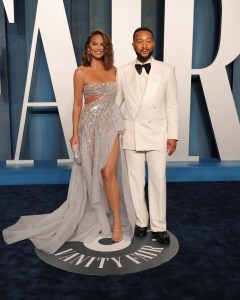 Chrissy Teigen and John Legend at the Vanity Fair Oscar Party held at the Wallis Annenberg Center for the Performing Arts on March 27th, 2022 in Beverly Hills, California.