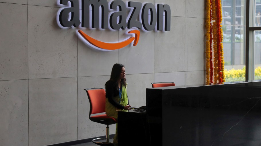 An Indian employee works at the reception desk of Amazon's campus building in Hyderabad, India.