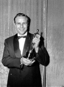 Oscar-winner Marlon Brando poses with his statuette at the 27th Annual Academy Awards at Pantages Theater in Hollywood, Ca. on March 30, 1955.  Brando won best actor of the year for his portrayal in "On the Waterfront."  (AP Photo)