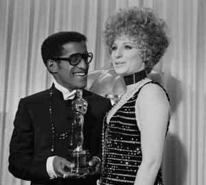 Barbra Streisand with Sammy Davis, Jr., who accepted the Oscar for  for Leslie Bricusse for "Doctor Dolittle," April 10, 1968 (AP Photo)