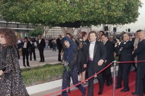 Rock singer Prince waves to the crowd upon his arrival outside the Dorothy Chandler Pavilion, site of the 57th Academy Awards, March 25, 1985 in Los Angeles. The singer won an Oscar for original score. (AP Photo/Doug Pizac)
