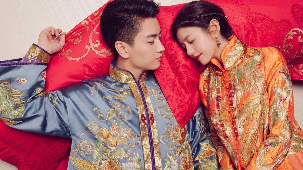 Chinese actor Chen Xiao and actress Michelle Chen getting married in reimagined Chinese traditional bridal ensembles by Guo Pei.