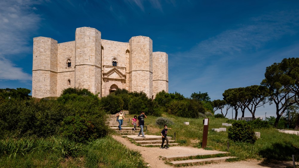 People who visit Castel del Monte on the day of its reopening on May 22, 2021 in Andria, Italy. With the yellow zone in Puglia, the places of culture of the territory are also reopening today. Among these, the Castel del Monte in Andria. Temporarily, the Puglia Museums Regional Directorate offers the possibility of free access to sites that are normally paid with booking via app and a visit to the inside of the Castle for a duration of 30 minutes. (Photo by Davide Pischettola/NurPhoto via AP)