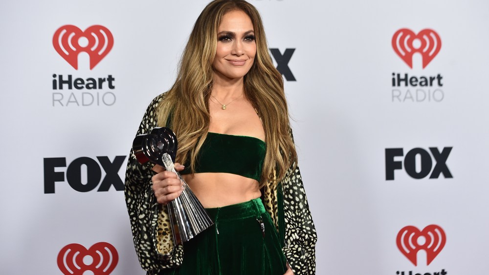 Jennifer Lopez poses in the press room with the Icon Award at the iHeartRadio Music Awards on Tuesday, March 22, 2022, at the Shrine Auditorium in Los Angeles. (Photo by Jordan Strauss/Invision/AP)