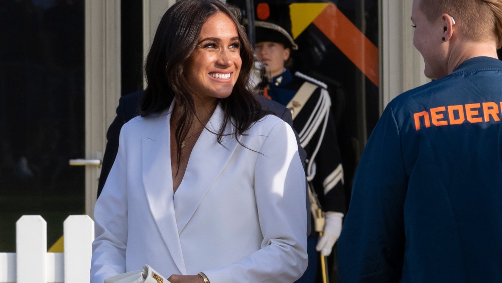 Meghan Markle, Duchess of Sussex, arrives at the Invictus Games venue in The Hague, Netherlands, Friday, April 15, 2022. The week-long games for active servicemen and veterans who are ill, injured or wounded opens Saturday, April 16, 2022, in this Dutch city that calls itself the global center of peace and justice. (AP Photo/Peter Dejong)