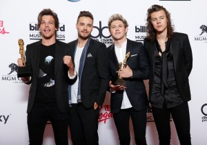 Louis Tomlinson, from left, Liam Payne, Niall Horan, and Harry Styles of the musical group One Direction pose in the press room with the awards for top duo/group and top touring artist at the Billboard Music Awards at the MGM Grand Garden Arena on Sunday, May 17, 2015, in Las Vegas. (Photo by Eric Jamison/Invision/AP)