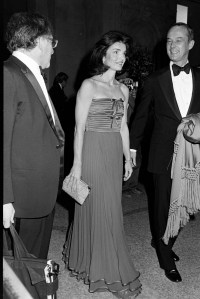 Karl Katz (L) event co-chair Jacqueline Kennedy Onassis and guest arrive for the Metropolitan Museum of Art "Vanity Fair: A Treasure Trove exhibition and gala in New York City on December 12, 1977.