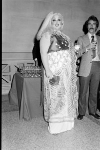 Divine (L) in Zandra Rhodes attends the Metropolitan Museum Costume Institute "Vanity Fair: A Treasure Trove" exhibition and gala in New York City on December 12, 1977.