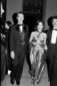 Halston and Bianca Jagger arrive for the Metropolitan Museum of Art "Vanity Fair: A Treasure Trove exhibition and gala in New York City on December 12, 1977.