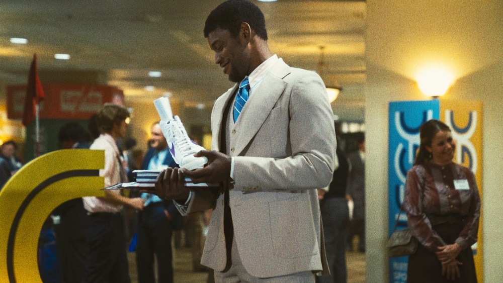 HBO's "Winning Time: The Rise of the Lakers Dynasty" depicts Phil Knight handing Magic Johnson a sample of his proposed Nike Magic sneaker.