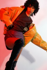 Rejina Pyo’s faux leather snake print jacket over Lamarque’s lamb leather and ponte di roma top and lamb leather shorts. Charles and Keith boots. Vitaly Design rings and bracelets.
