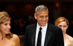 George Clooney, center, attends the White House Correspondents' Association Dinner headlined by late-night comic Jimmy Kimmel, Saturday, April 28, 2012, in Washington. (AP Photo/Haraz N. Ghanbari)