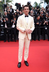 Miles Teller poses for photographers upon arrival at the premiere of the film 'Top Gun: Maverick' at the 75th international film festival, Cannes, southern France, Wednesday, May 18, 2022. (Photo by Vianney Le Caer/Invision/AP)