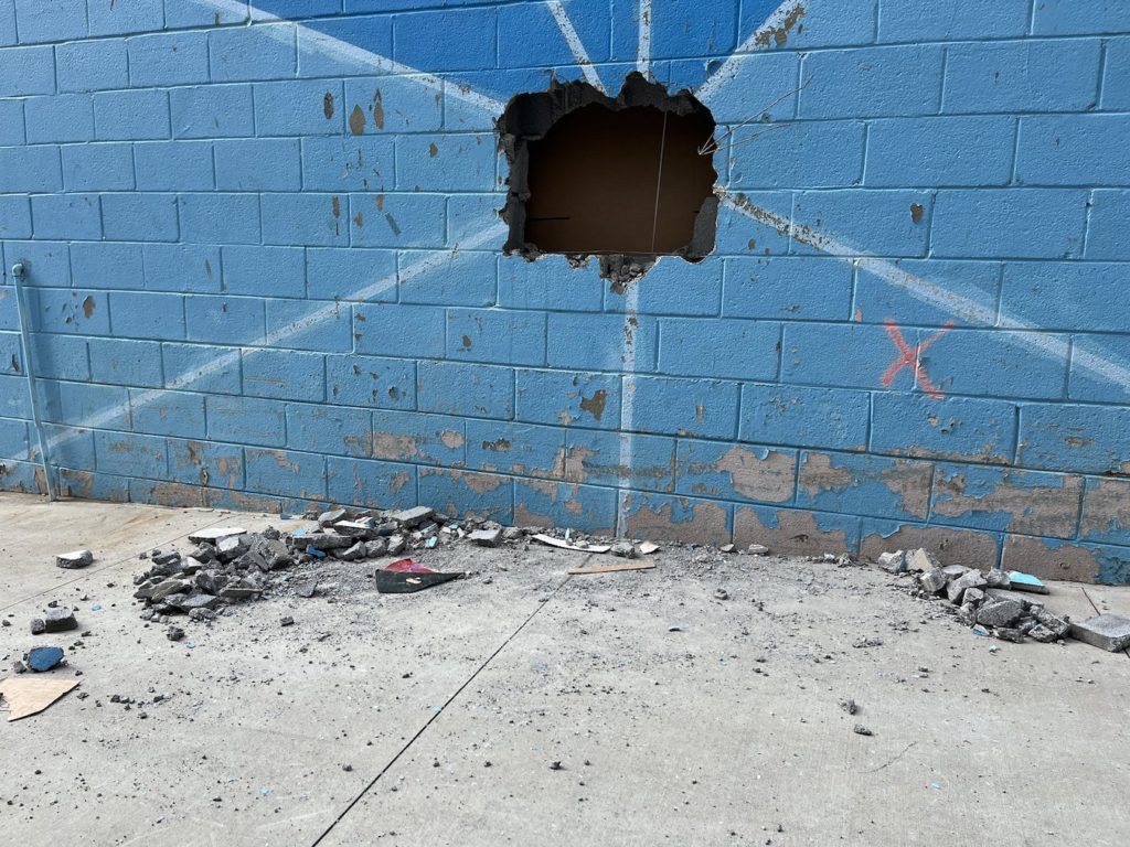 During the investigation, the owners of the store discovered a hole at the back of the cinderblock wall, which is where the attempted break-in was said to have occurred (seen below).