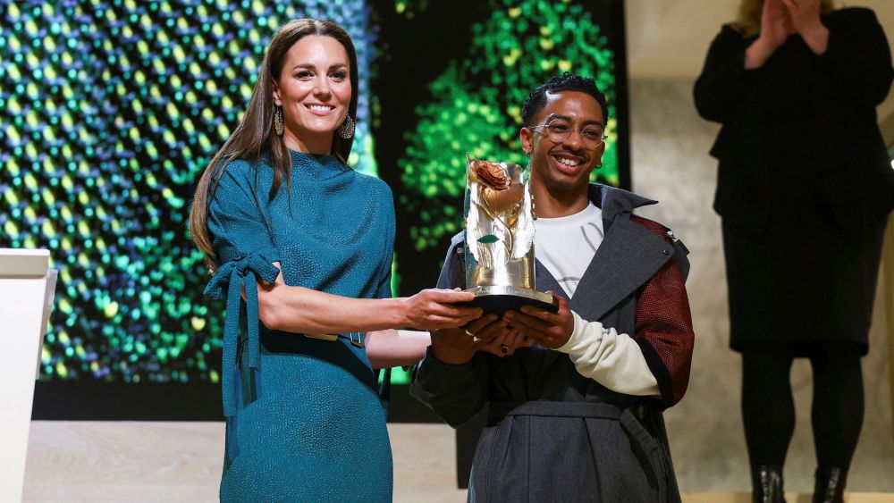 Britain's Kate, Duchess of Cambridge presents the Queen Elizabeth II Award for British Design to Saul Nash at an event hosted by the British Fashion Council at the Design Museum in London.