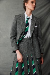 Thom Browne’s cotton oxford long-sleeve button-down shirt and Herringbone Harris Tweed’s trench, blazer, skirt and tie. Etiq earrings; Bulgari watch; David Yurman bracelet; Louis Vuitton bracelet; Vitali bracelet.