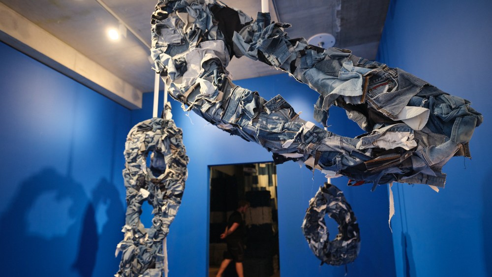 Suspended denim sculptures at the Indigo show at No. 9 Cork Street in London.