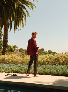 Jil Sander’s leather shirt jacket; Loewe’s silk shirt and sandals; Brioni’s wool and silk blend pants. David Yurman ring.